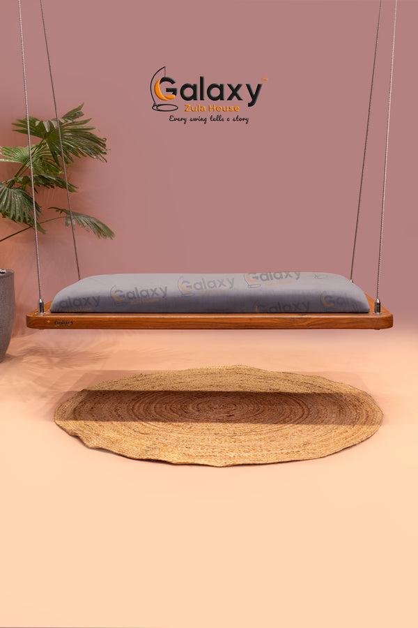 Swing with cushion in traditional wooden khat design